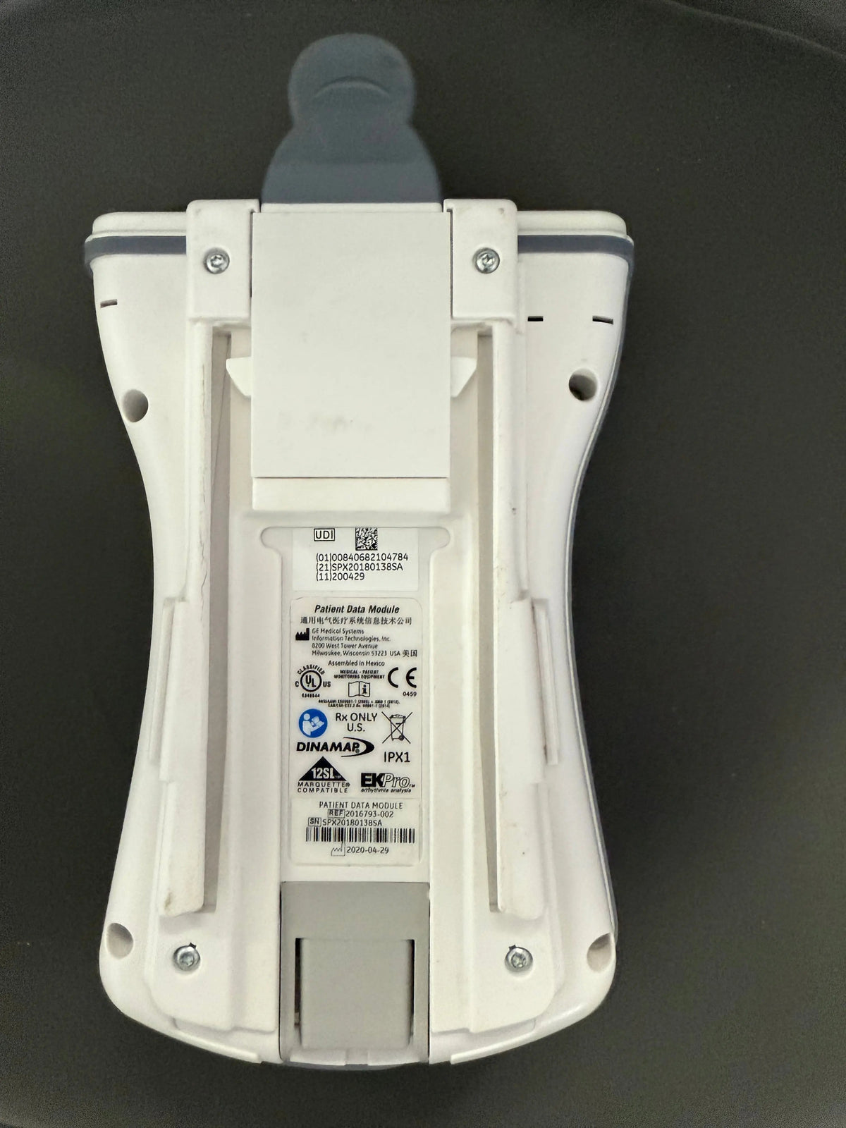 Bottom view of GE patient data module with integrated SpO₂ and ECG inputs