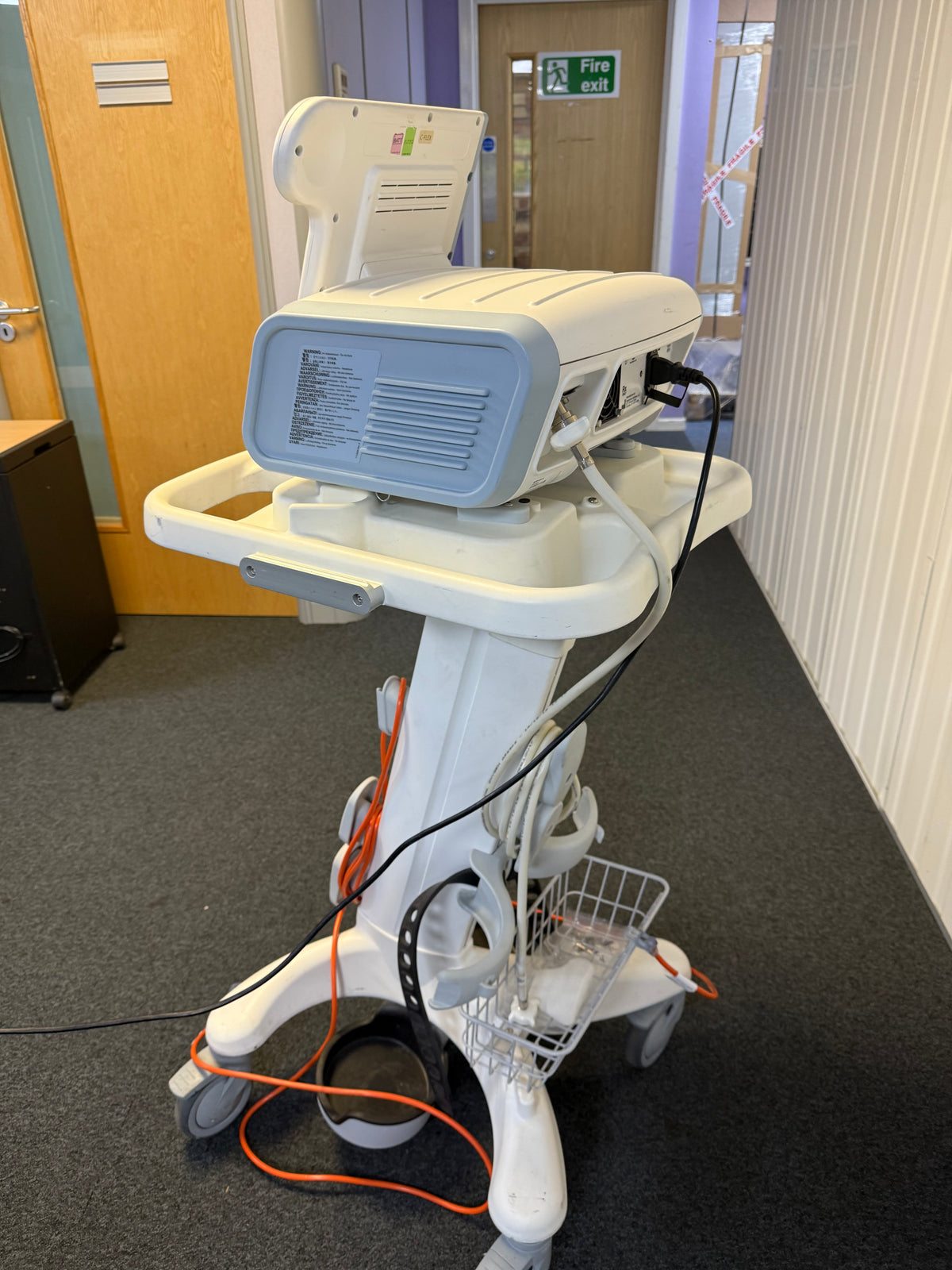 Side view of Philips V60 ventilator showing compact design and control ports