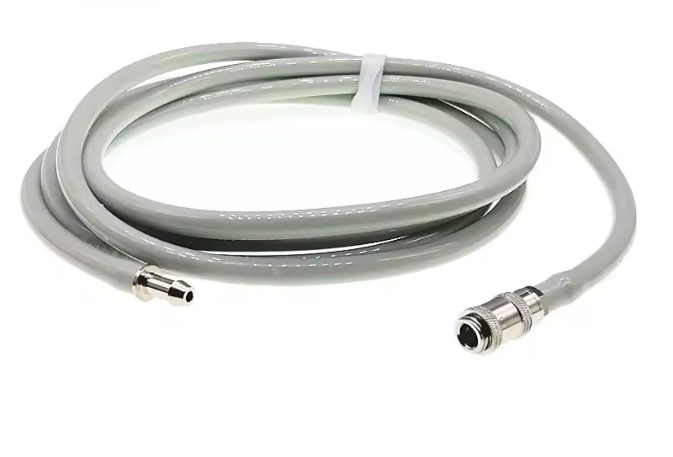Coiled NIBP cable with connectors on a white background