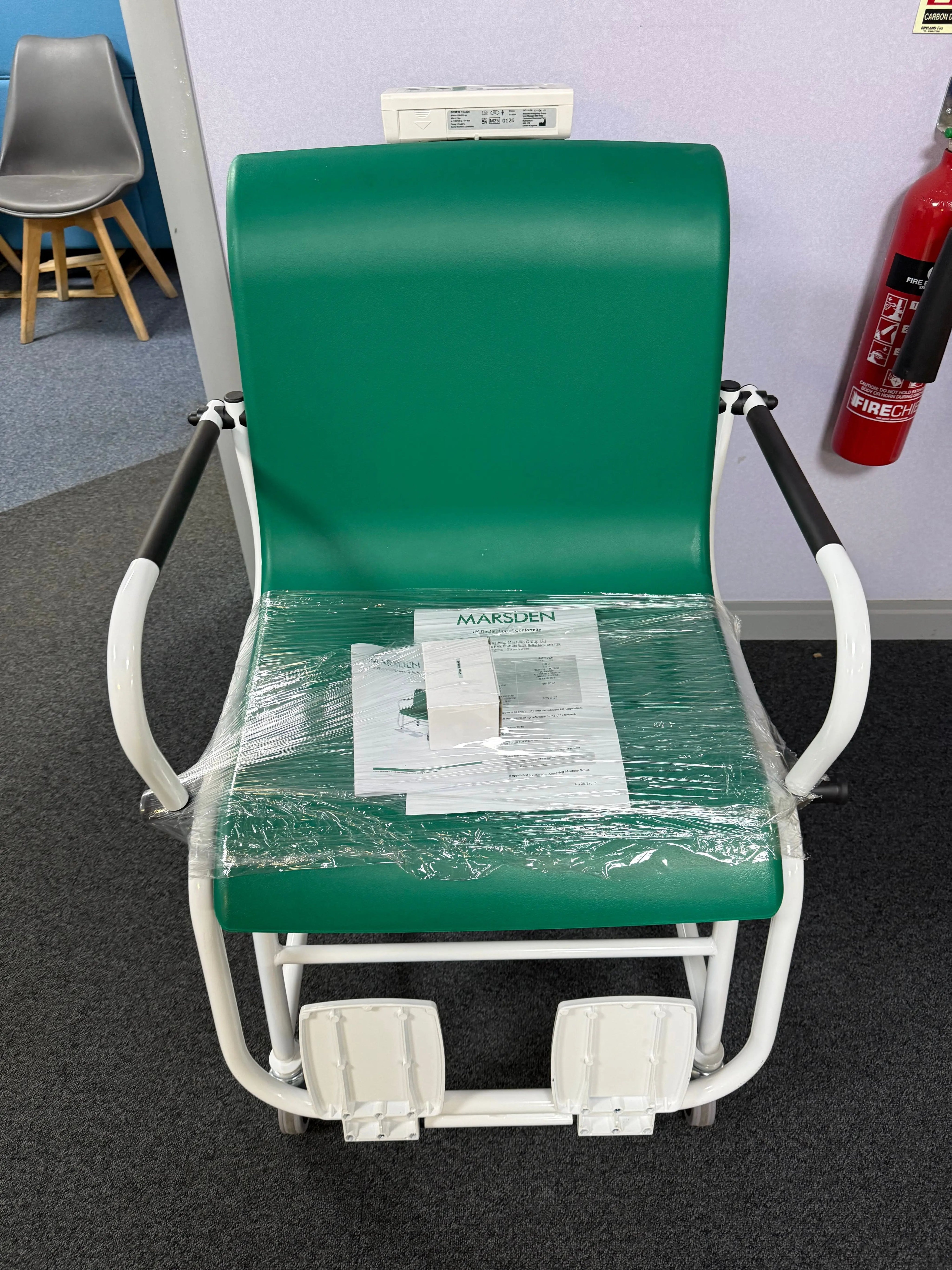 Front view of Marsden M-200 high-capacity digital chair scale with footrests and armrests