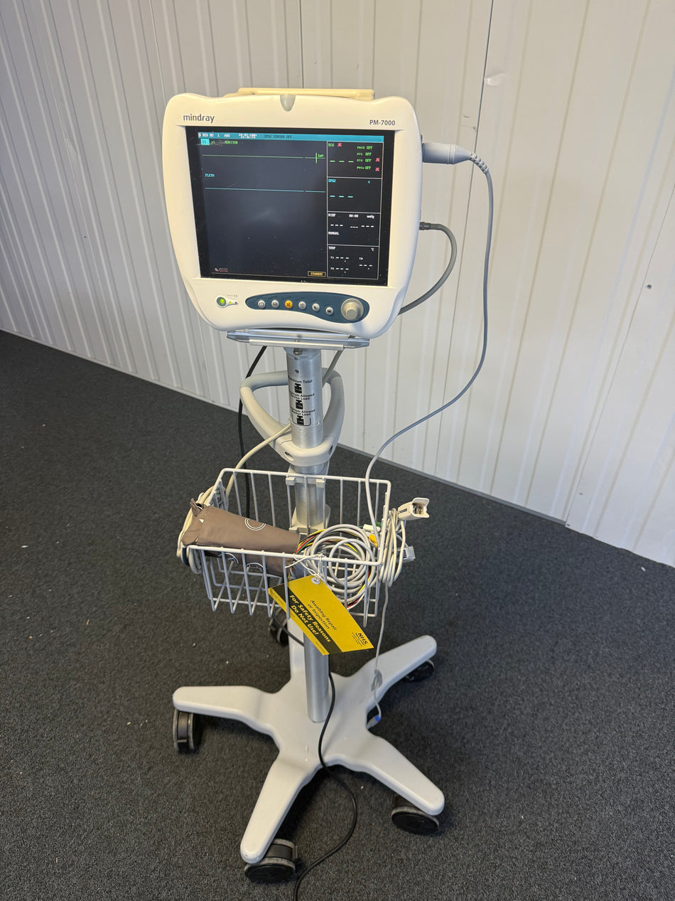PM-7000 monitor on trolley displaying ECG and SpO₂ readings