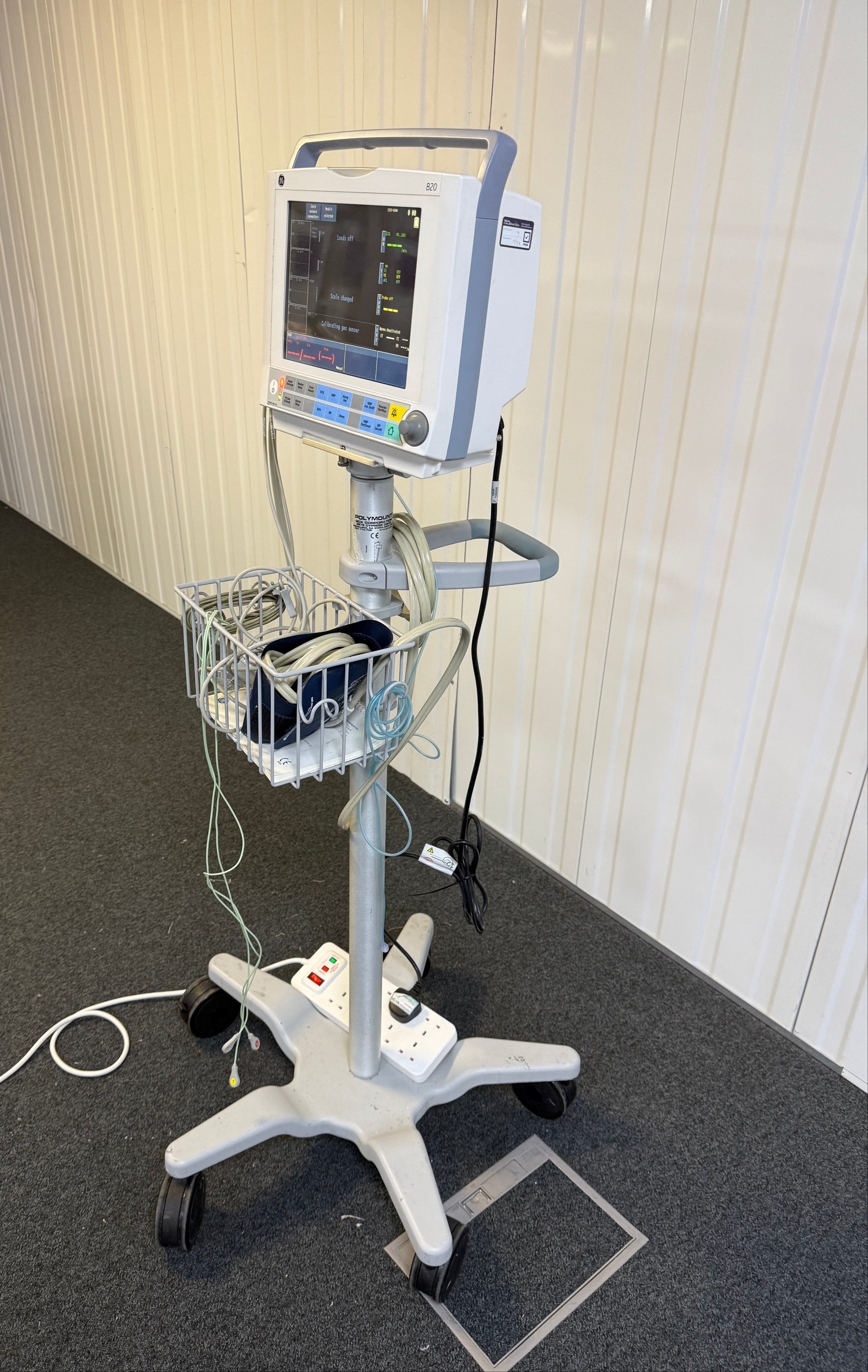 Side view of GE Carescape B20 patient monitor with cables