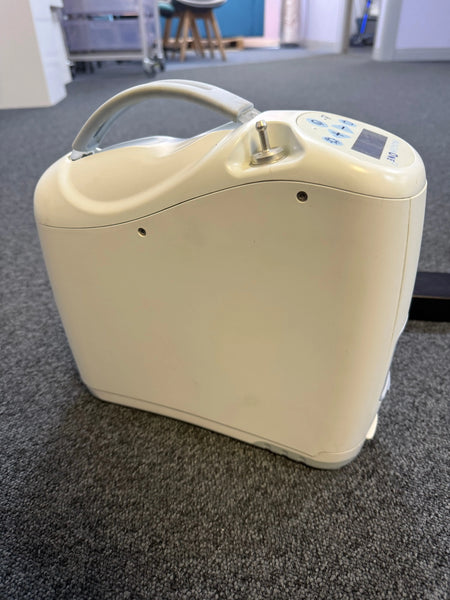 Side view of Inogen G2 unit showing compact size and oxygen ports