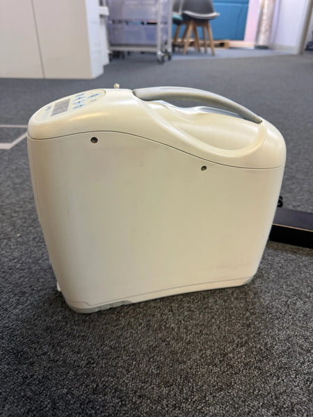 Side view of Inogen G2 unit showing compact size and oxygen ports