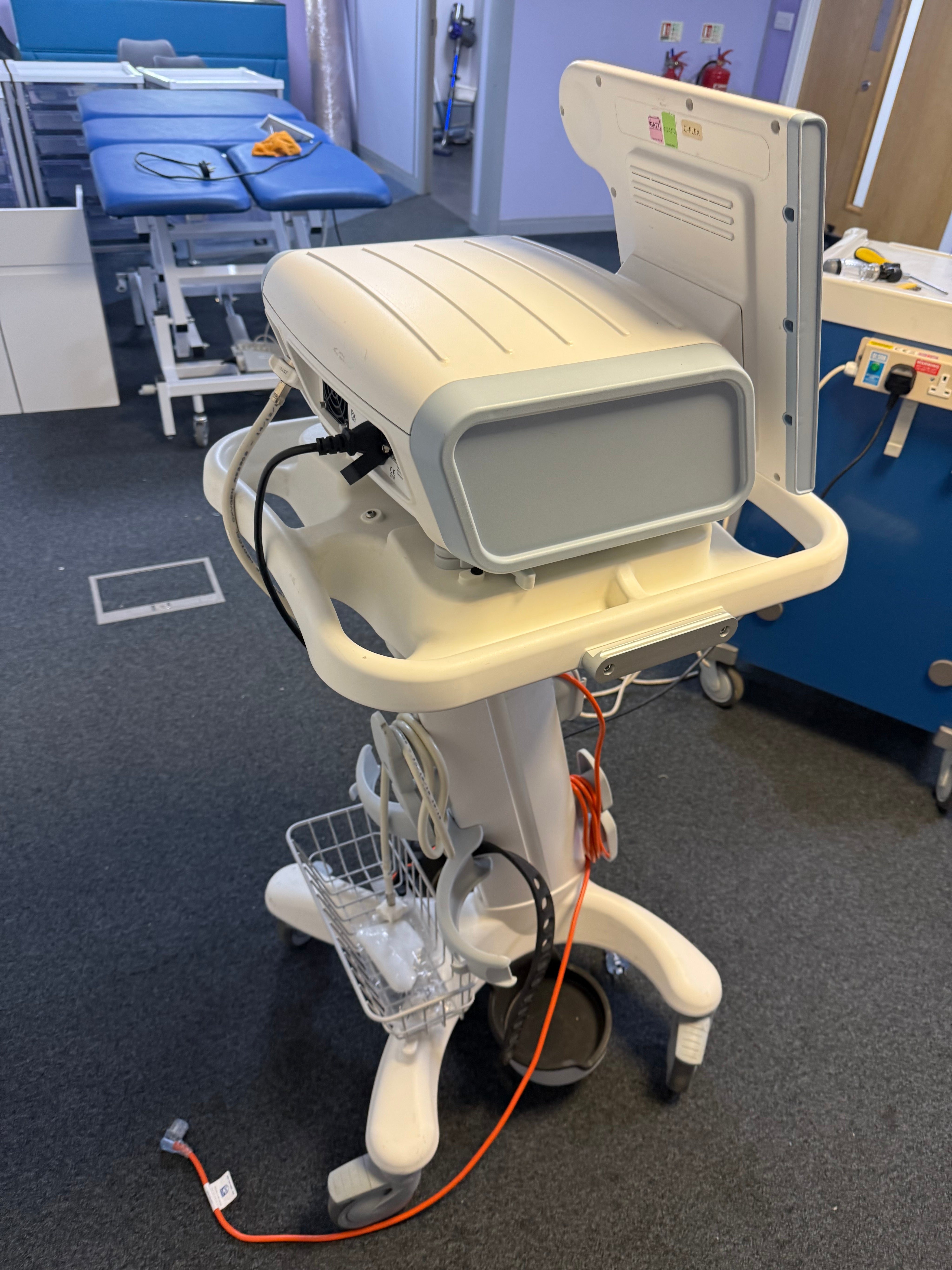 Side view of Philips V60 ventilator showing compact design and control ports