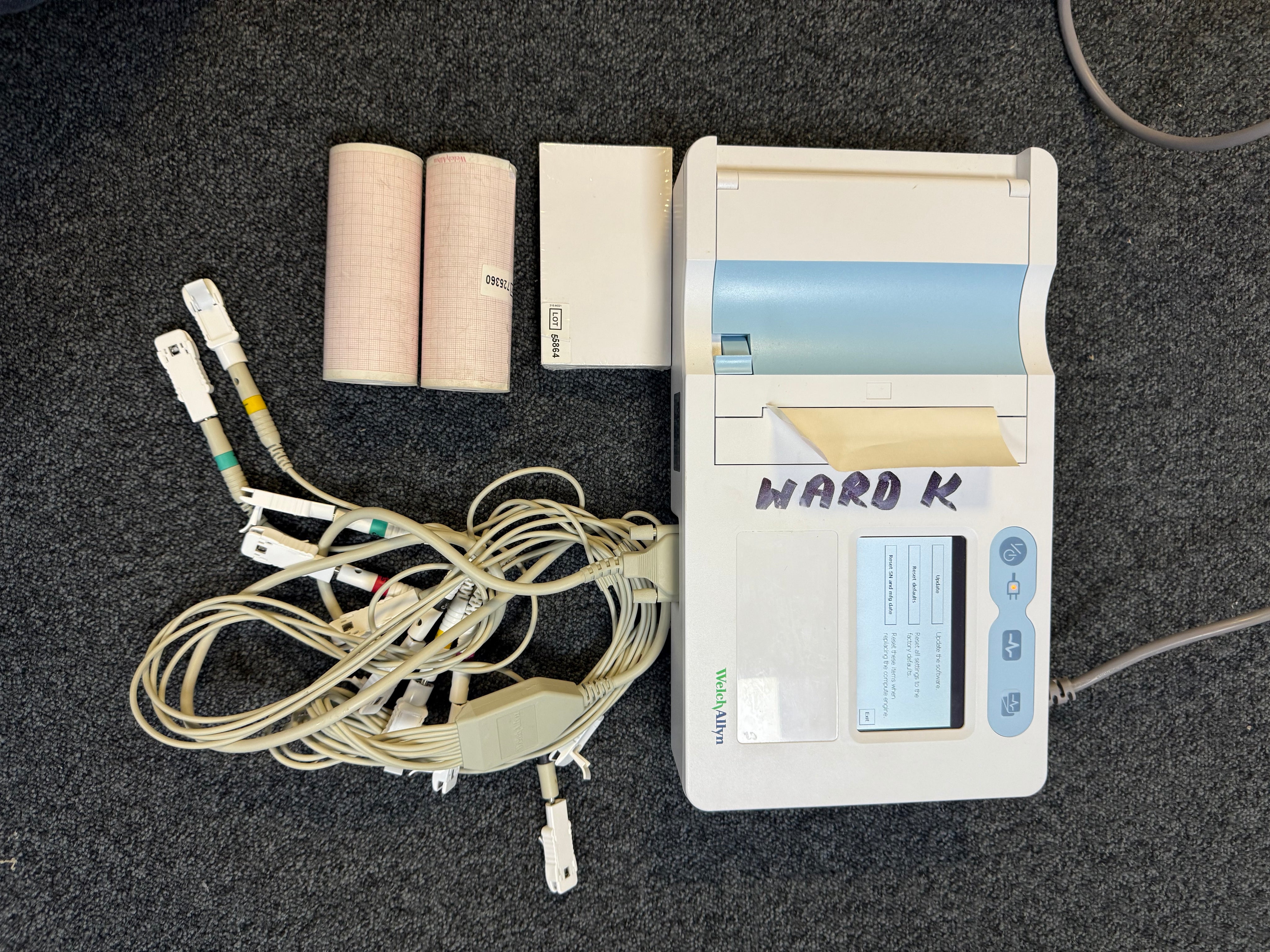 Welch Allyn CP50 ECG unit showing ECG waveform on screen