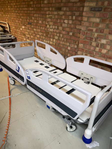 Close-up of the control panel on the Innova Interlude NewCare V3 electric bed for precise positioning.