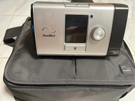 ResMed LUMIS 150 CPAP device on a carrying case