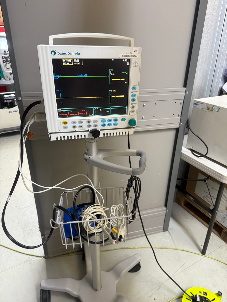 GE Datex Ohmeda S/5 FM Patient Monitor with accessories on a Trolley Stand