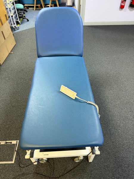 Adjustable examination couch with retractable castors for mobility