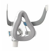 Gray and white CPAP mask on a white background
