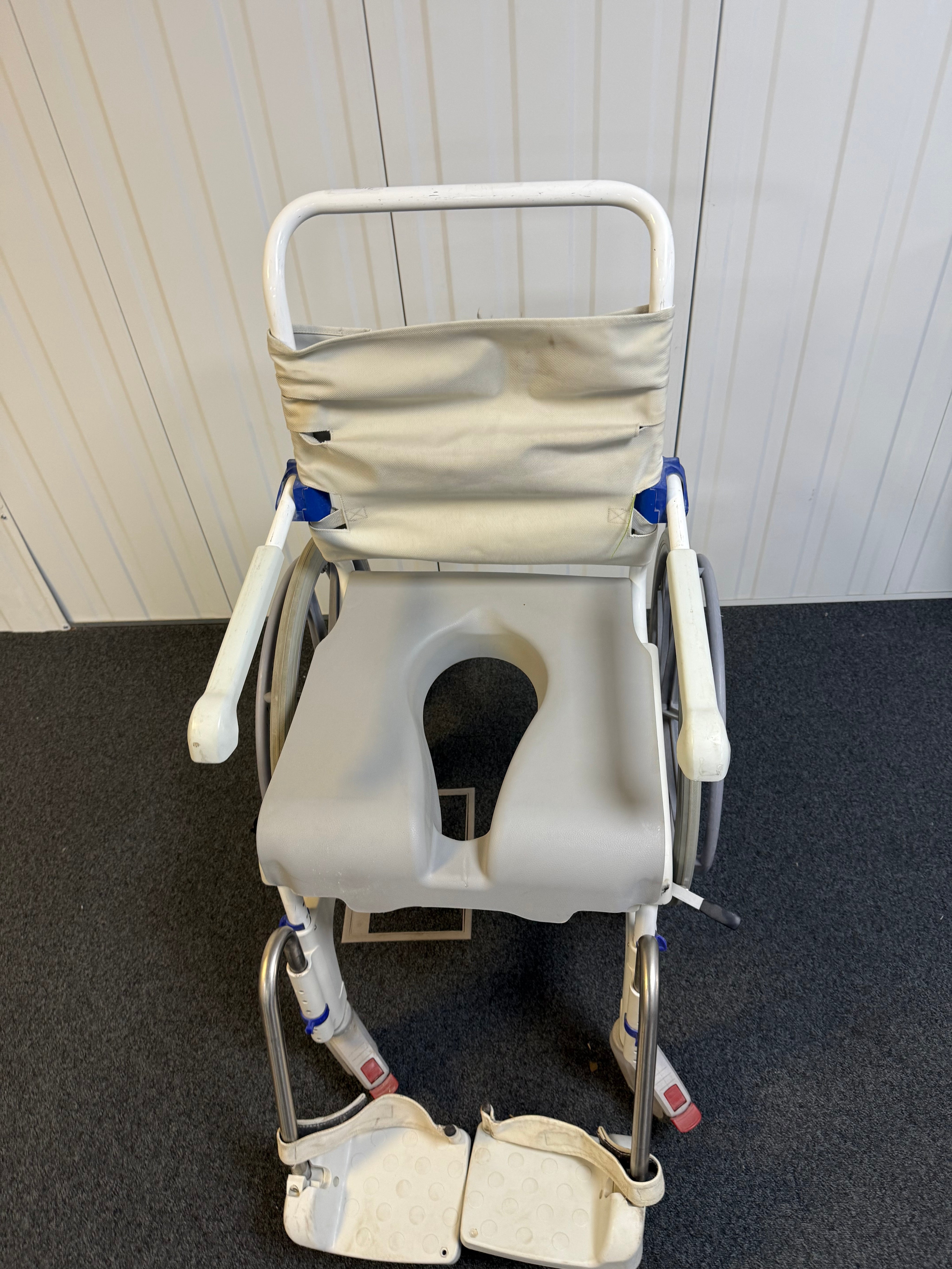 Aquatec Ocean Ergo XL bariatric commode chair with large rear wheels for independent mobility