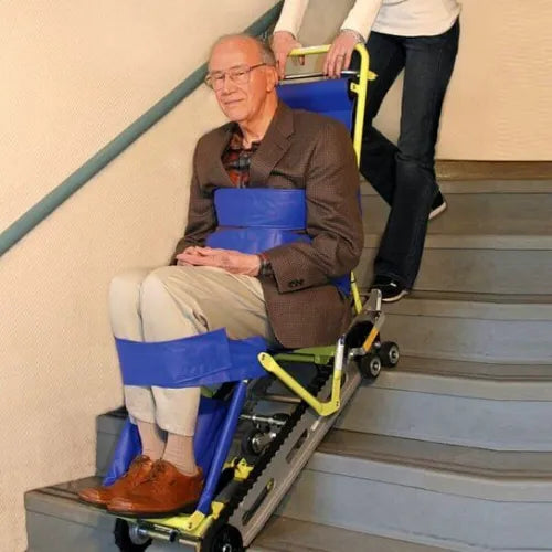 Attendant operating Garaventa Evacu-Trac with passenger