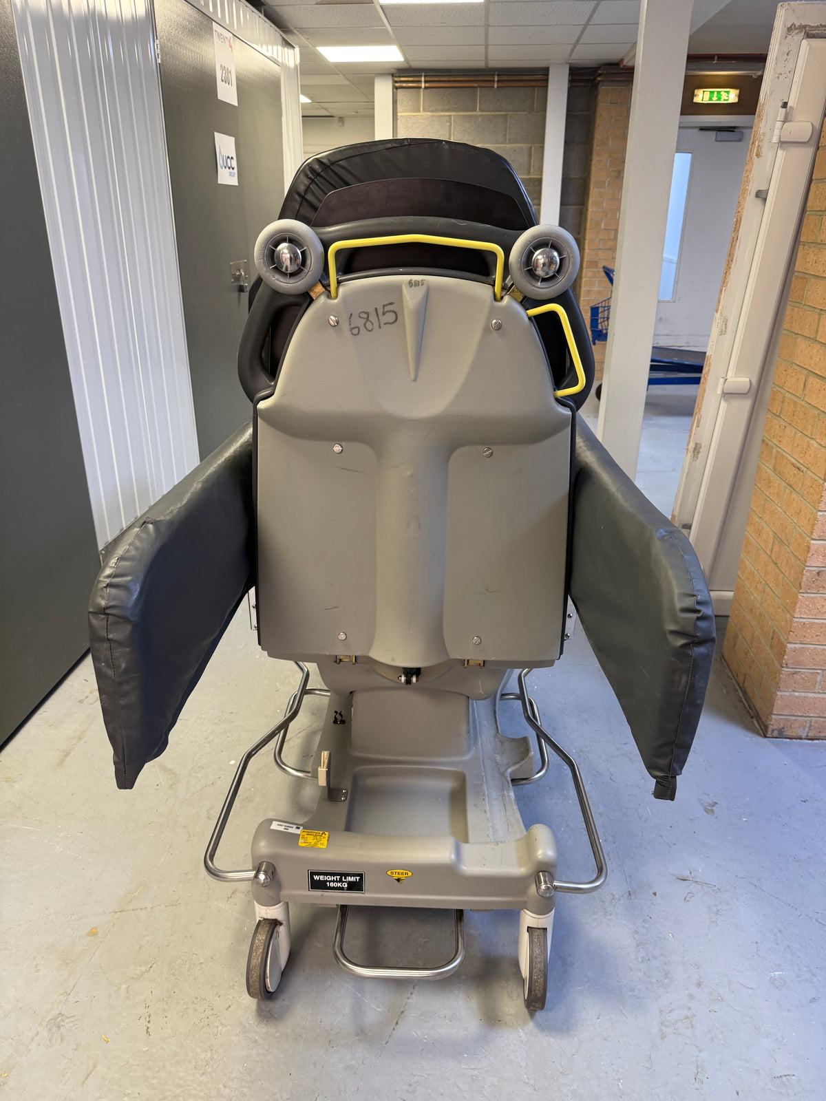 Back view of Anetic Aid QA3 hydraulic Patient Trolley with side rail covers