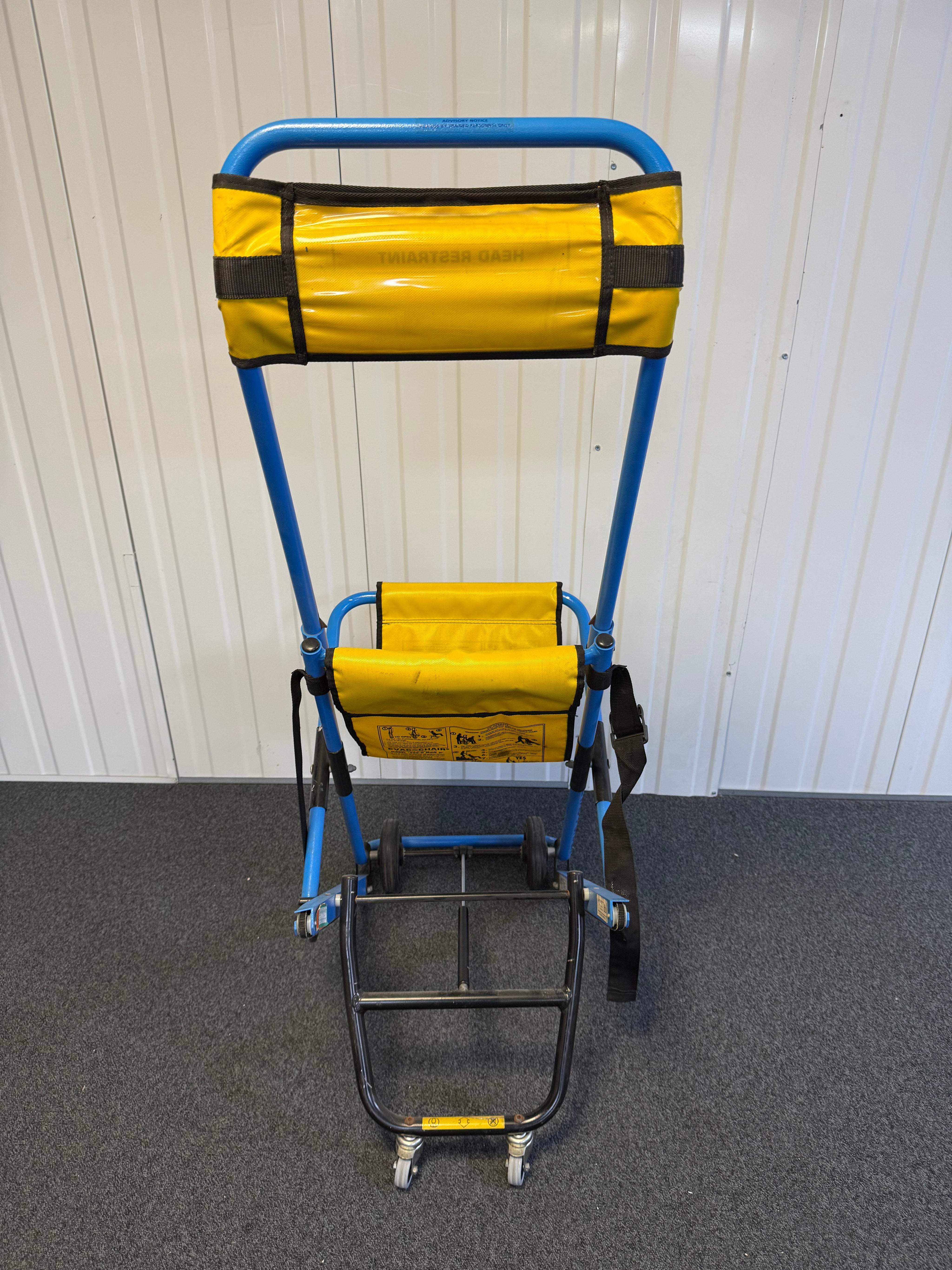 Back view of Evac+Chair MK2 highlighting four-wheel configuration
