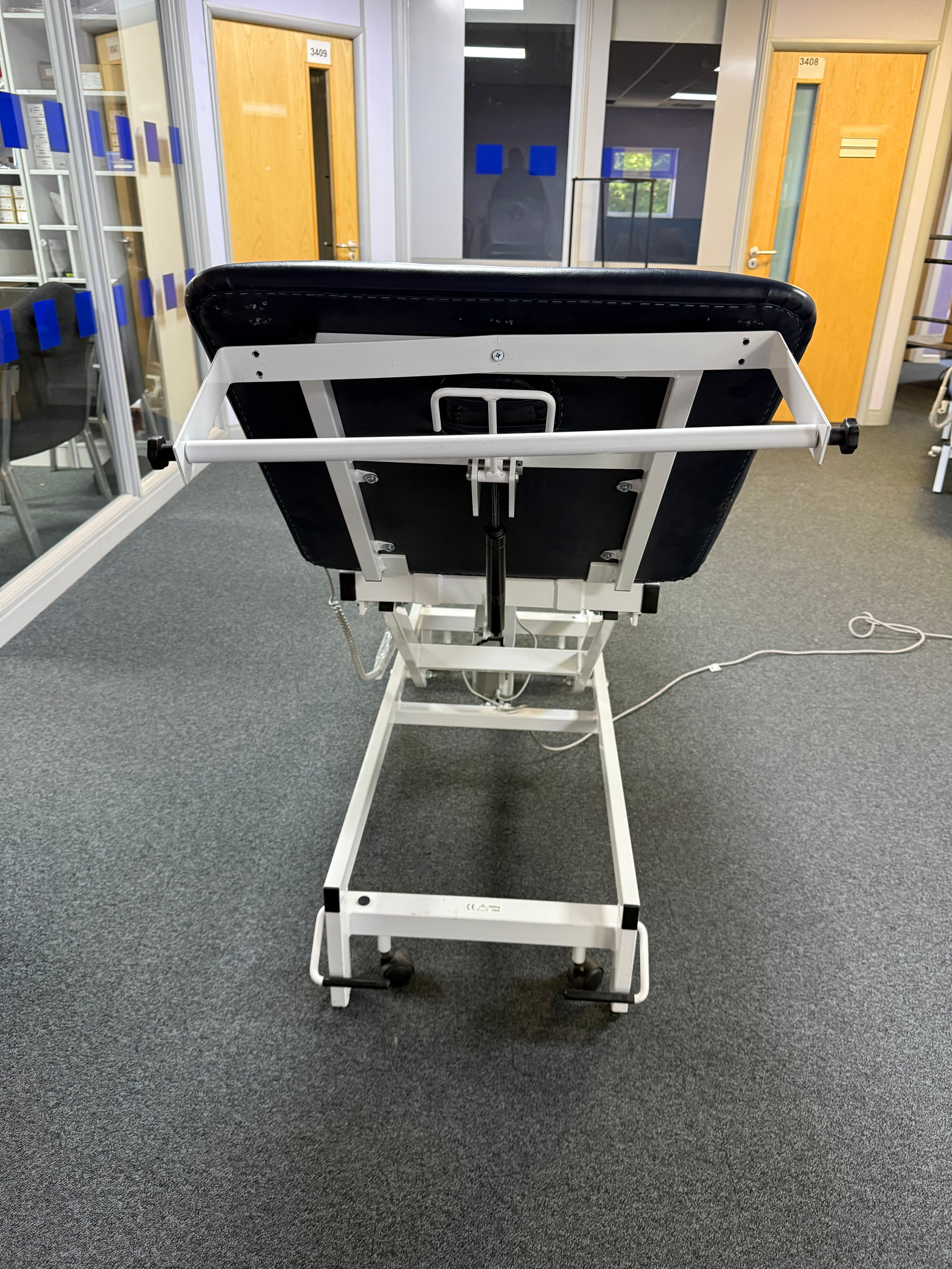 Back view of G Shaw examination couch showing manual backrest