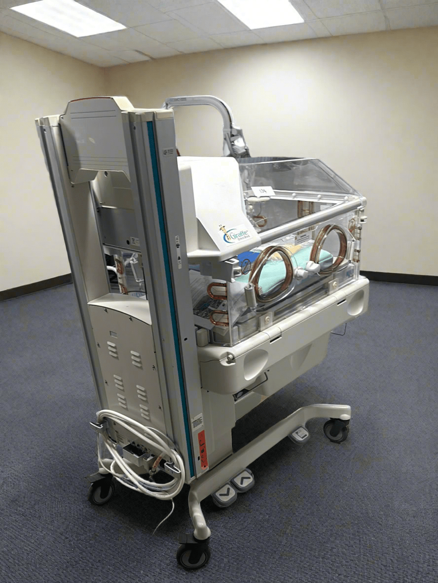 Back view showing portholes and rotating mattress system