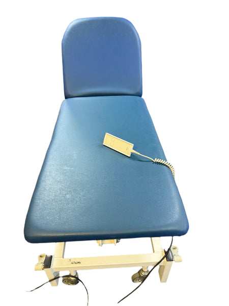 Bristol Maid Electric Examination Couch in raised position with foot controller