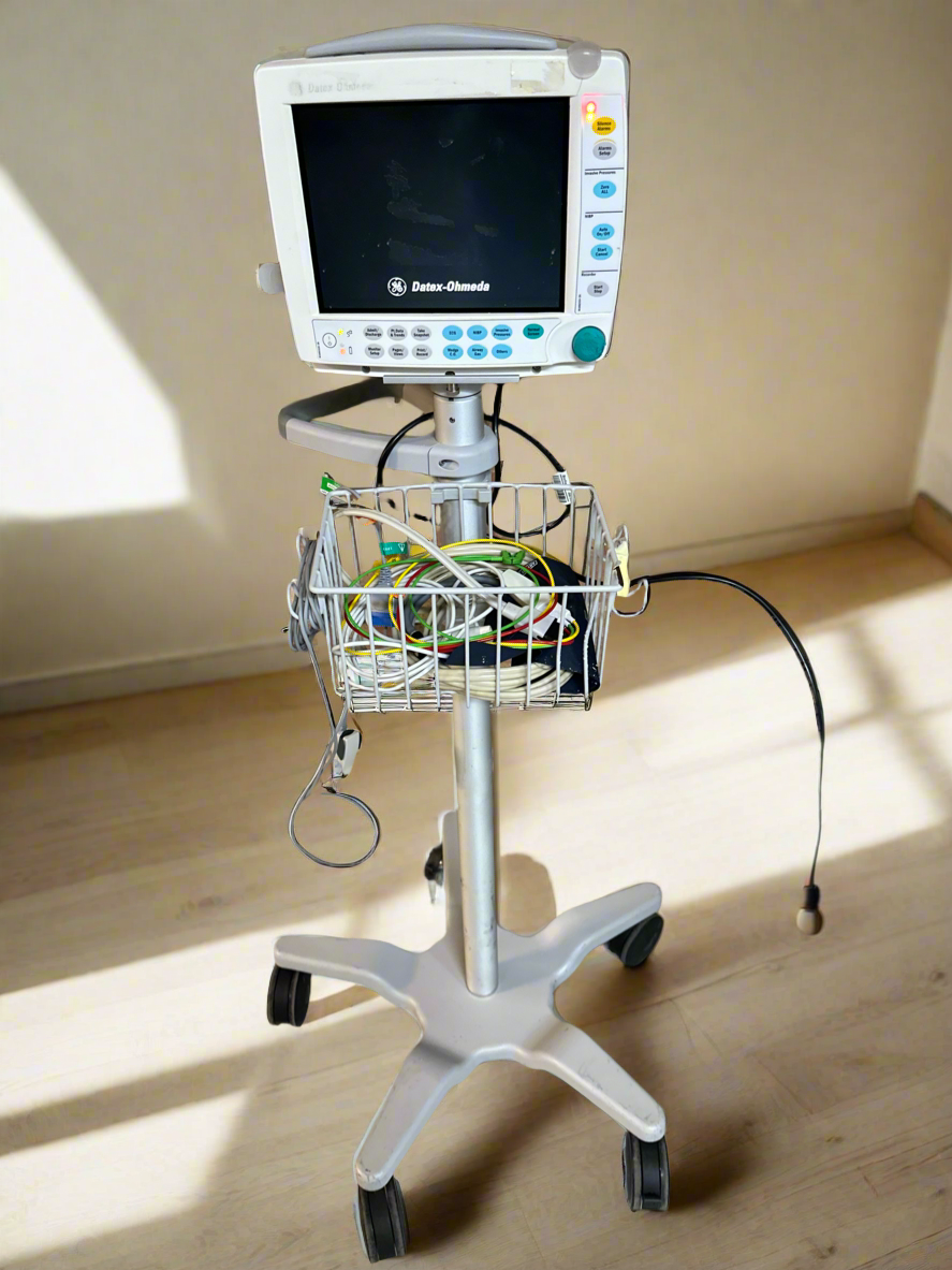 GE Datex Ohmeda S/5 FM Patient Monitor with accessories on a Trolley Stand