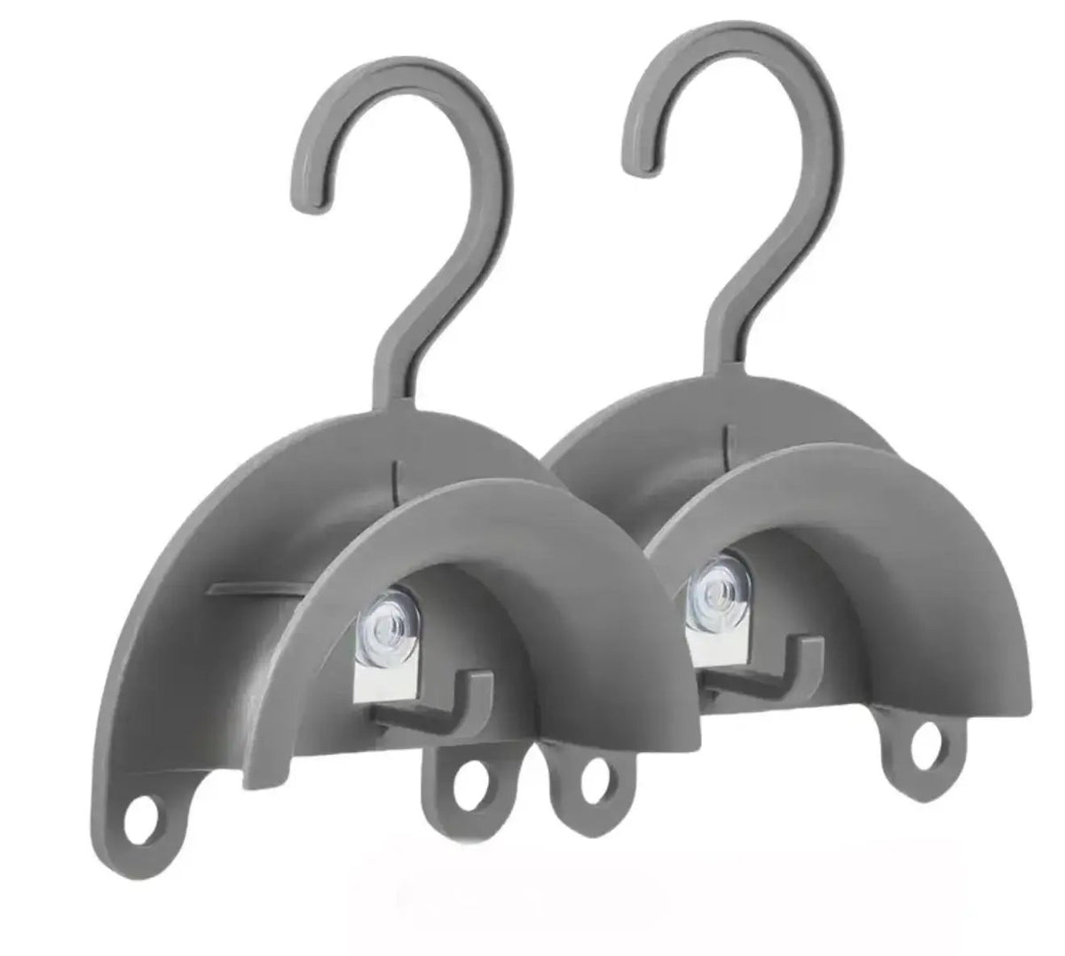 Two gray plastic hooks on a white background