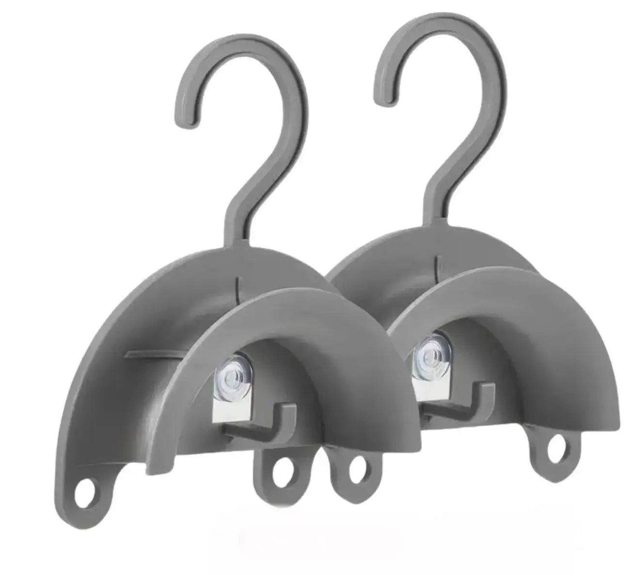 Two gray plastic hooks on a white background