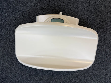 Close-up of Seca 385 digital display showing weight reading