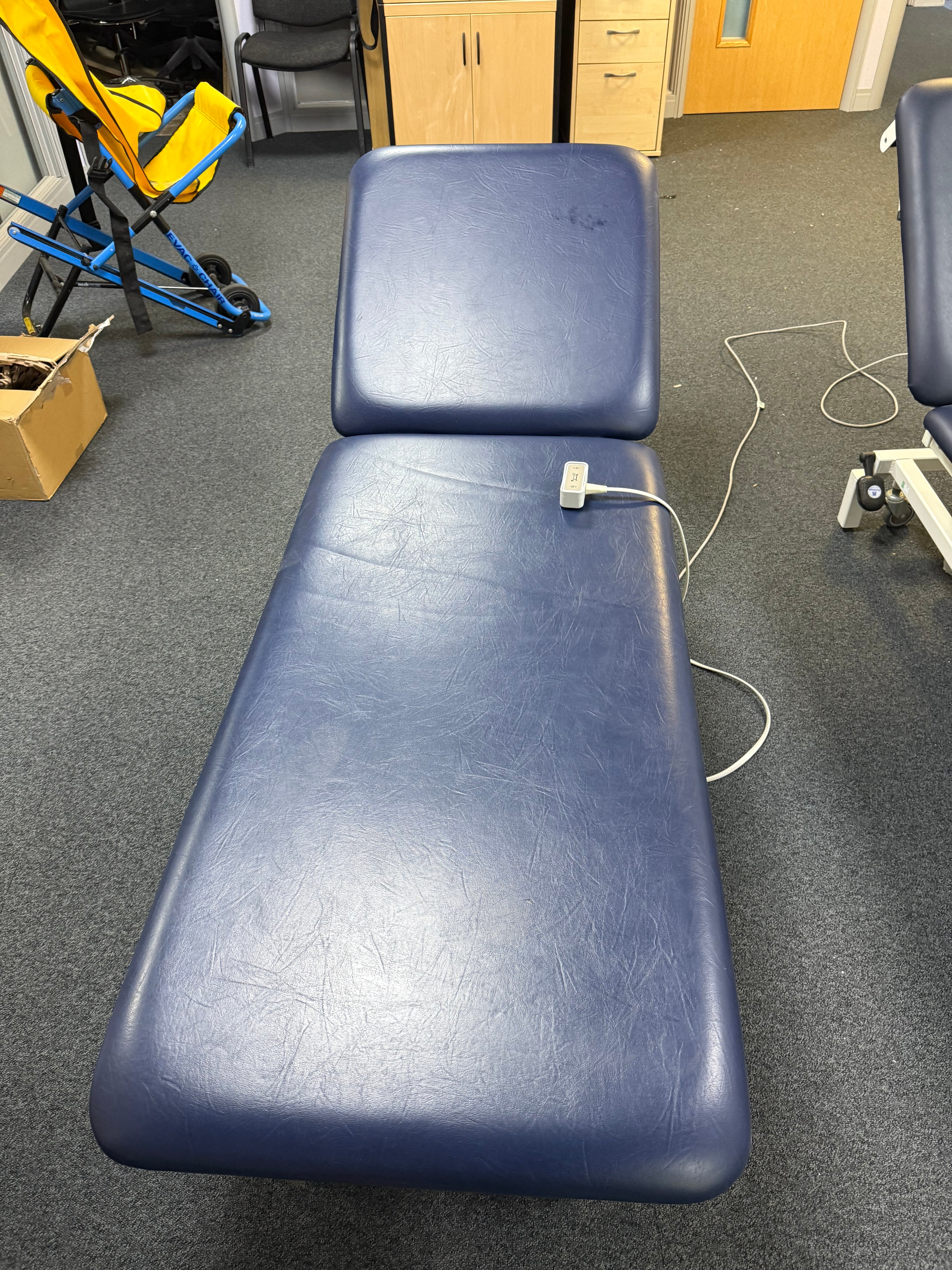 Huntleigh Akron 2-Section Electric Couch in clinical setting