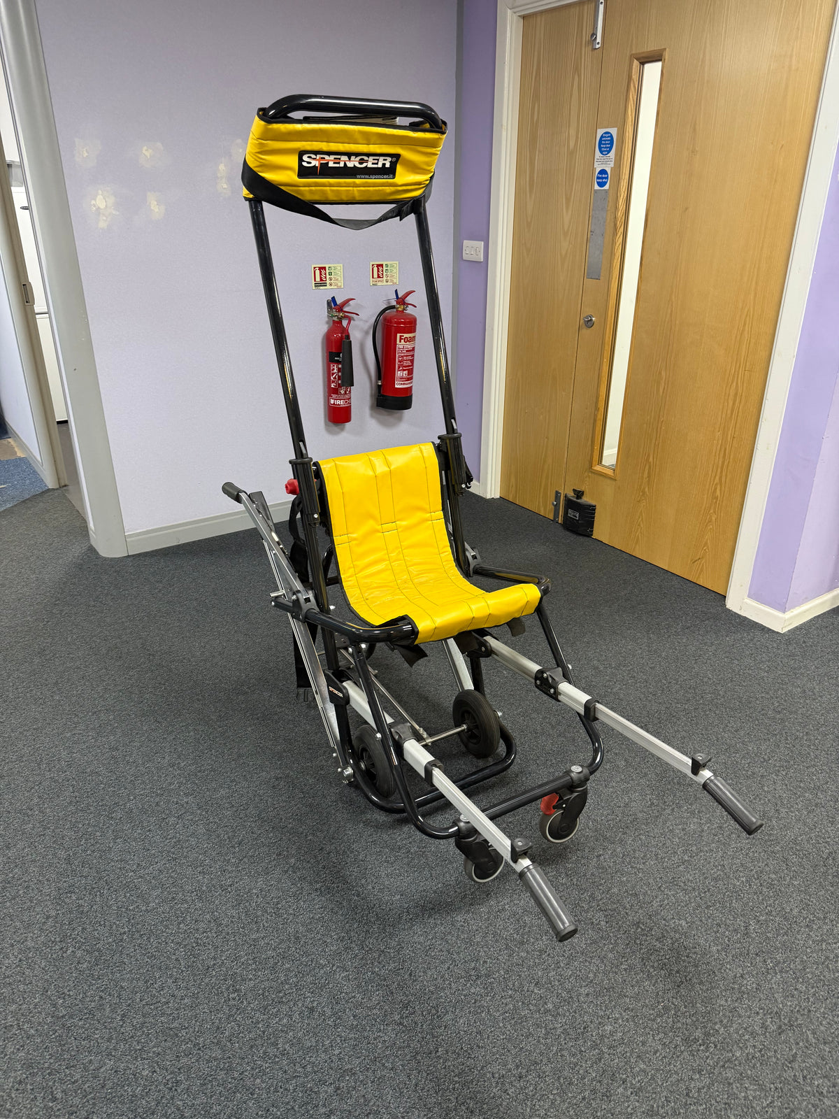 Spencer Skid evacuation chair descending stairs using passive caterpillar belt