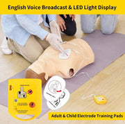 CPR training mannequin with electrodes and English voice broadcast system on a wooden floor.