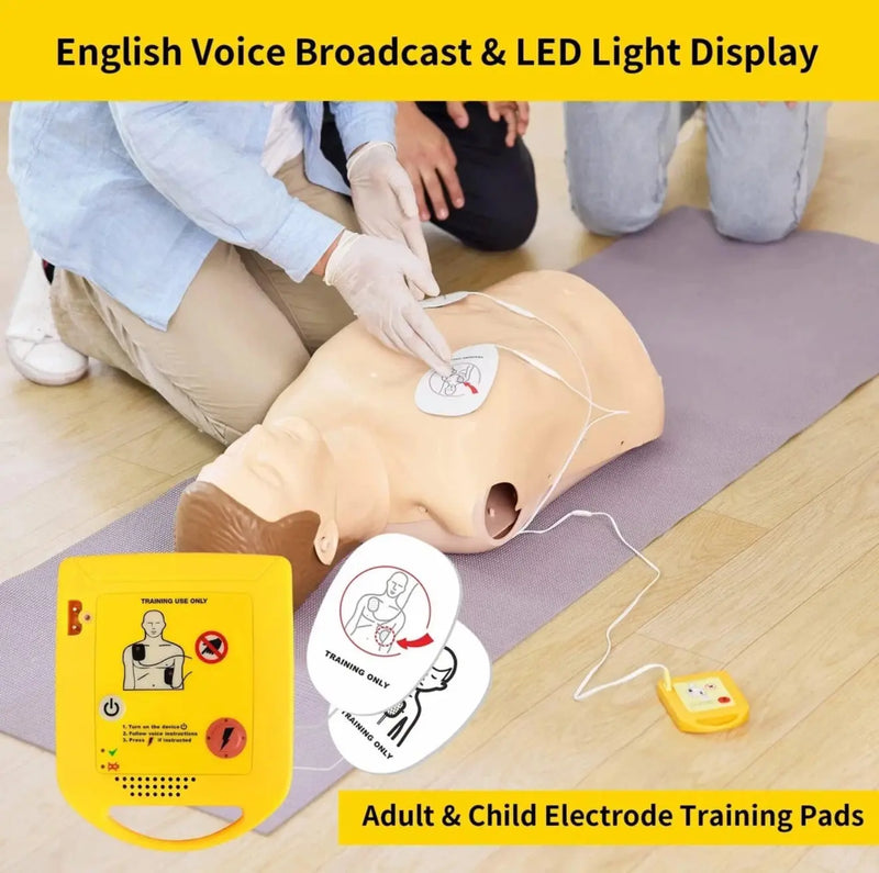 CPR training mannequin with electrodes and English voice broadcast system on a wooden floor.