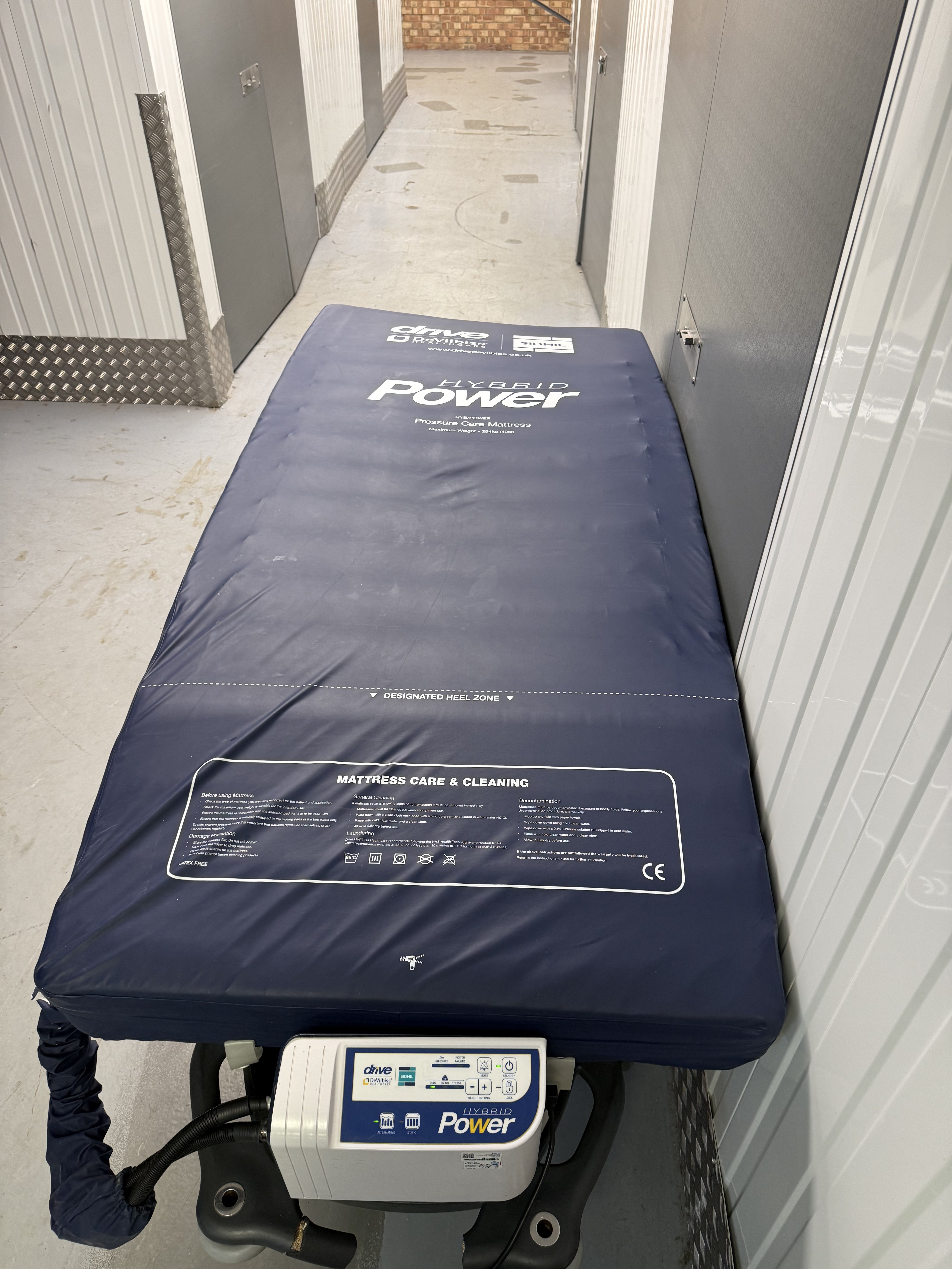 DeVilbiss pressure care mattress positioned on hospital profiling bed