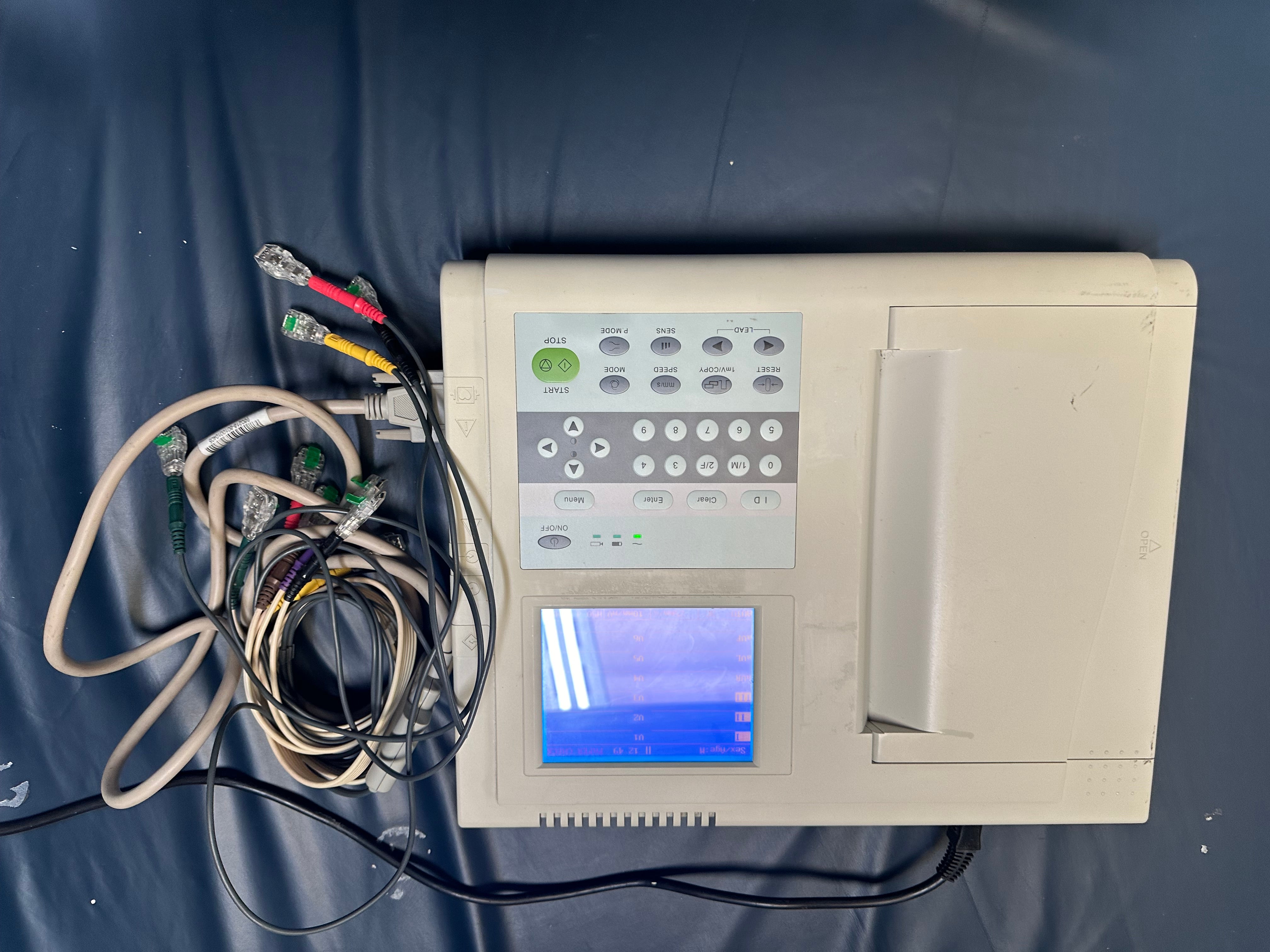 Close-up of power supply and charger included with the ECG machine