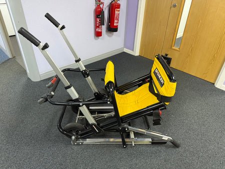 Folded Spencer evacuation chair with transport handles detached
