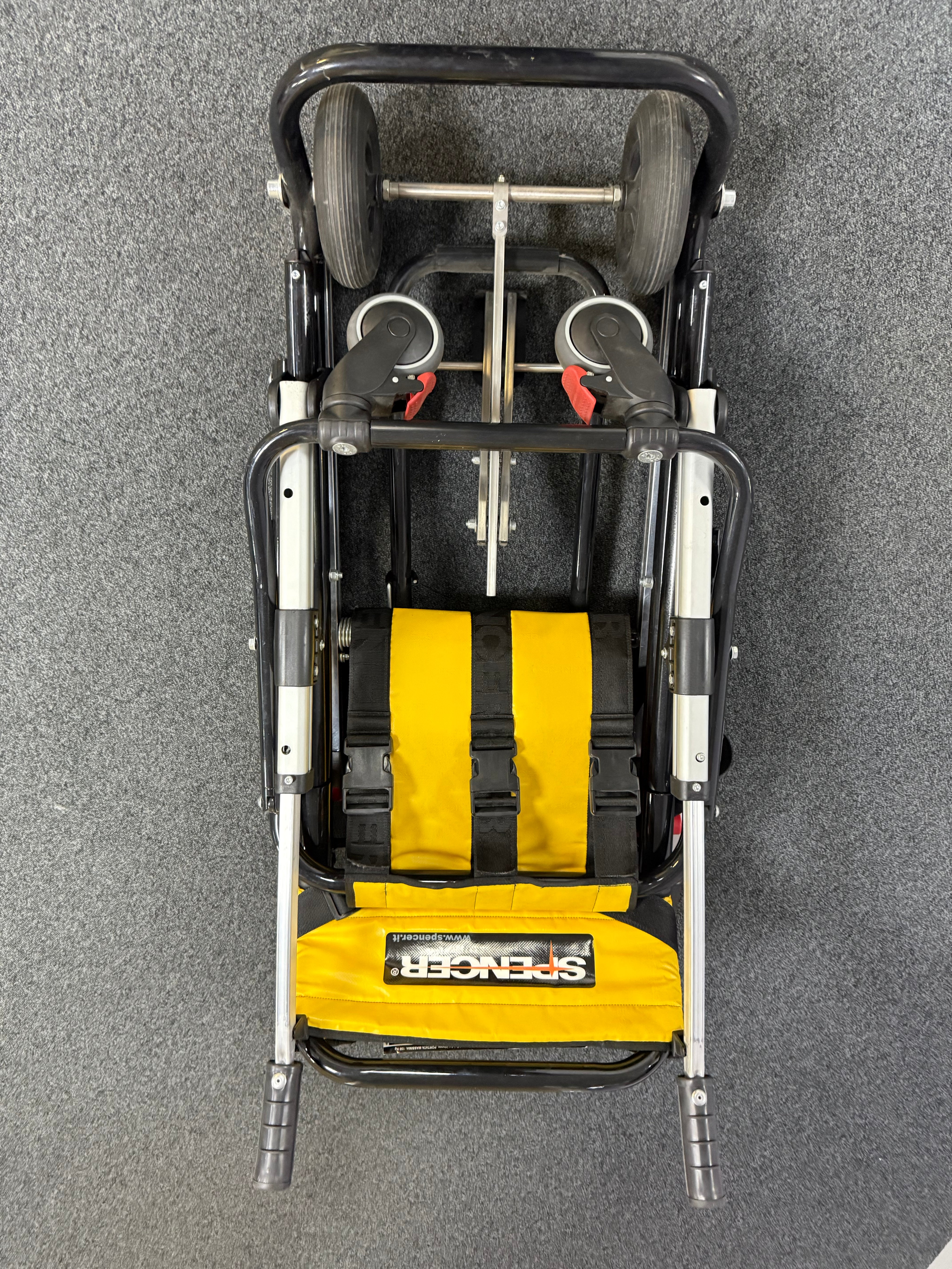 Folded Spencer evacuation chair with transport handles detached