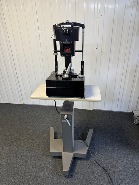 Front view of AO 12415 tonometer mounted on adjustable table