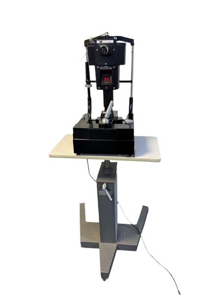 Front view of AO 12415 tonometer mounted on adjustable table