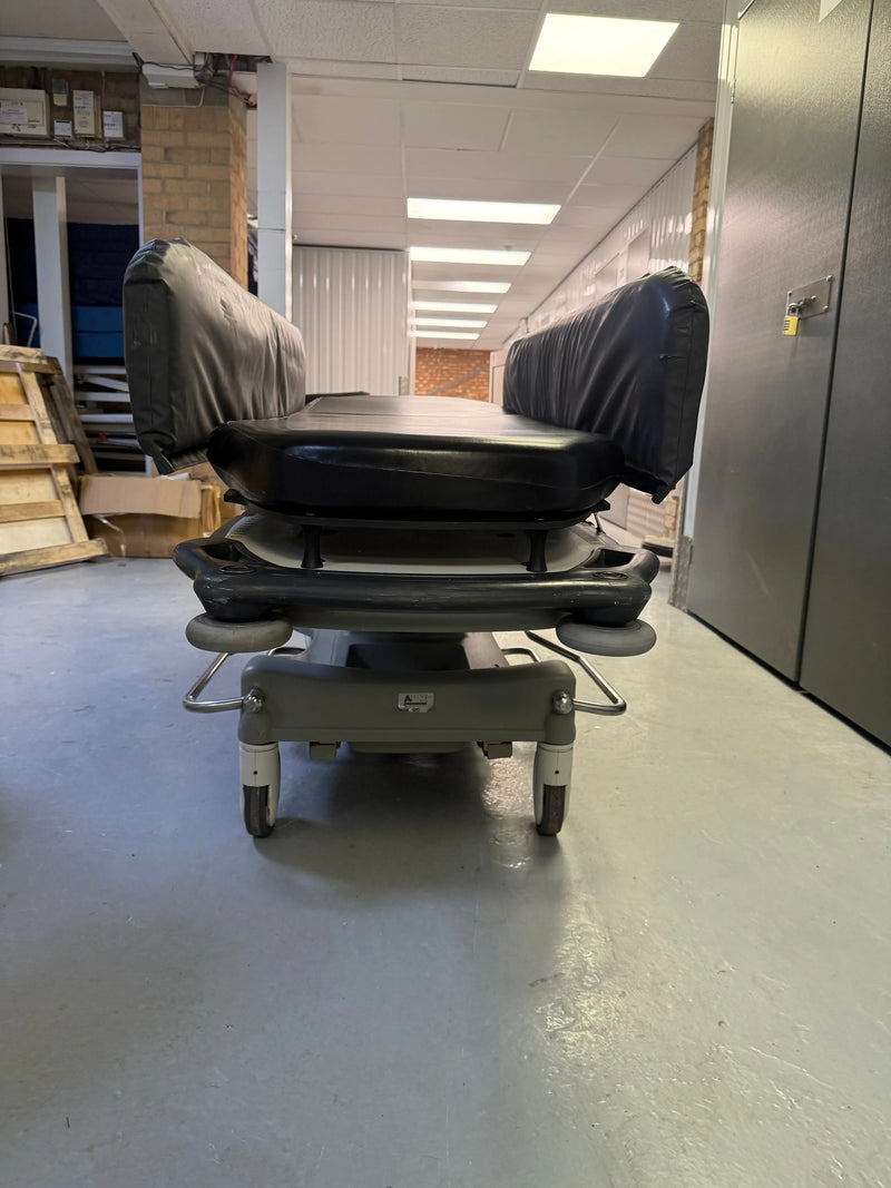Front view of Anetic Aid QA3 hydraulic Patient Trolley with side rail covers