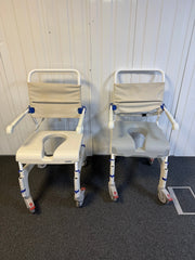 Front view of Aquatec Ocean Ergo XL Shower Commode Chair showcasing stainless steel frame