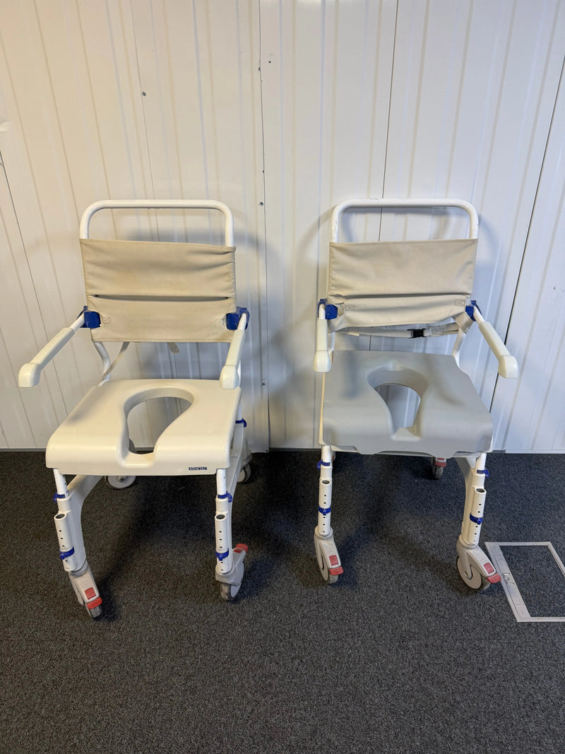 Front view of Aquatec Ocean Ergo XL Shower Commode Chair showcasing stainless steel frame