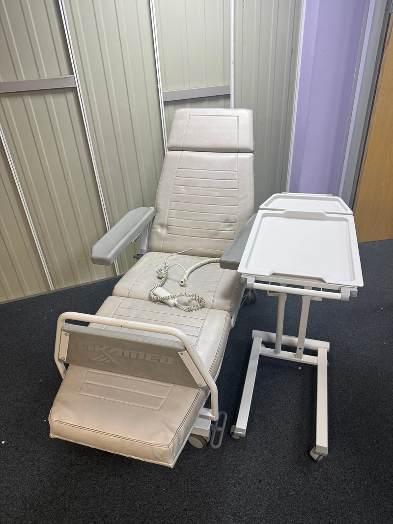 Full dialysis chair and table set up in clinical treatment bay