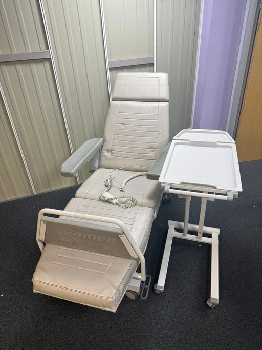 Full dialysis chair and table set up in clinical treatment bay