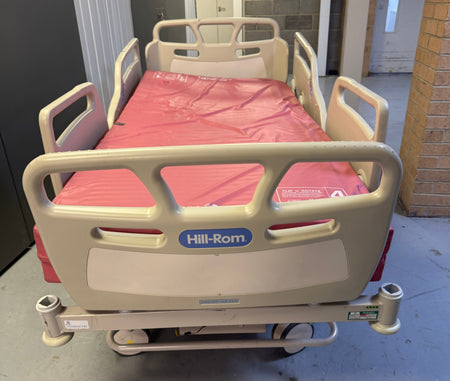 Fully adjustable Hill-Rom bed with included mattress