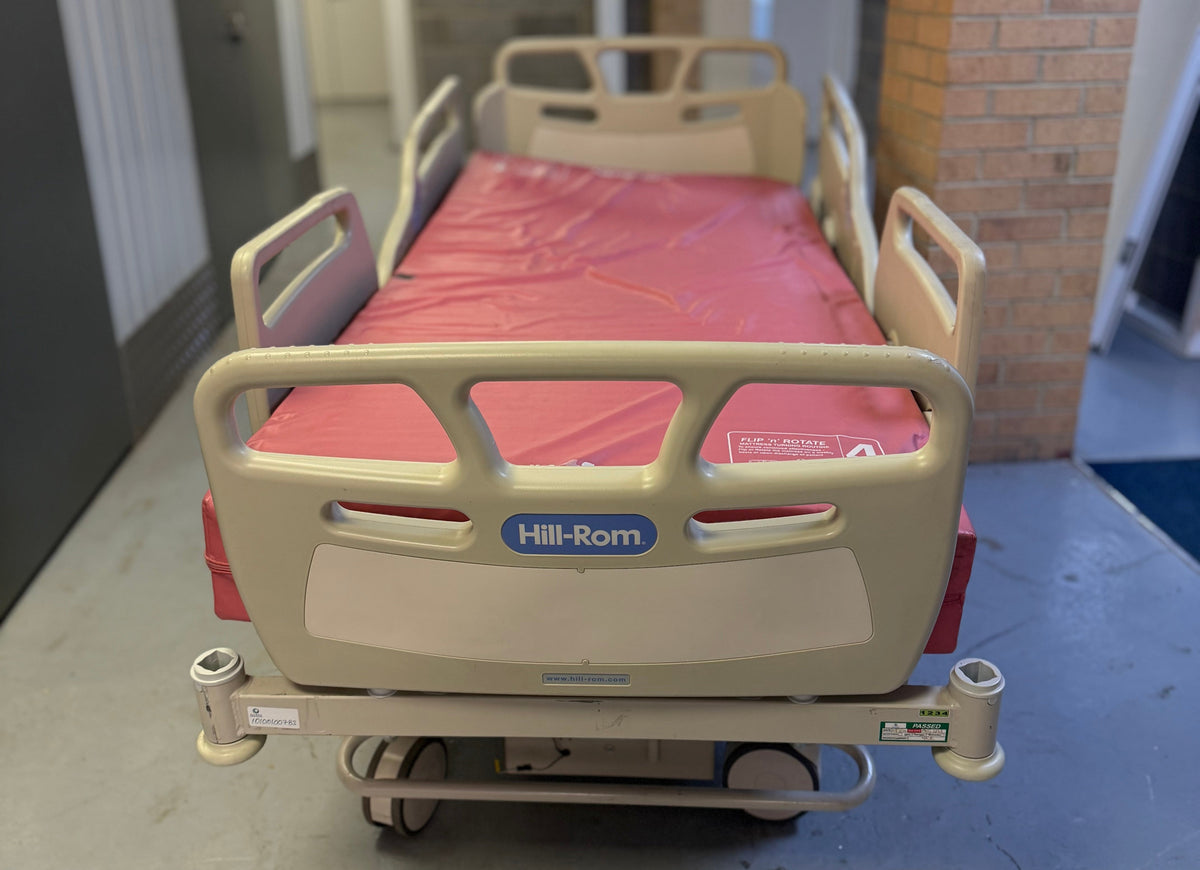 Fully adjustable Hill-Rom bed with included mattress