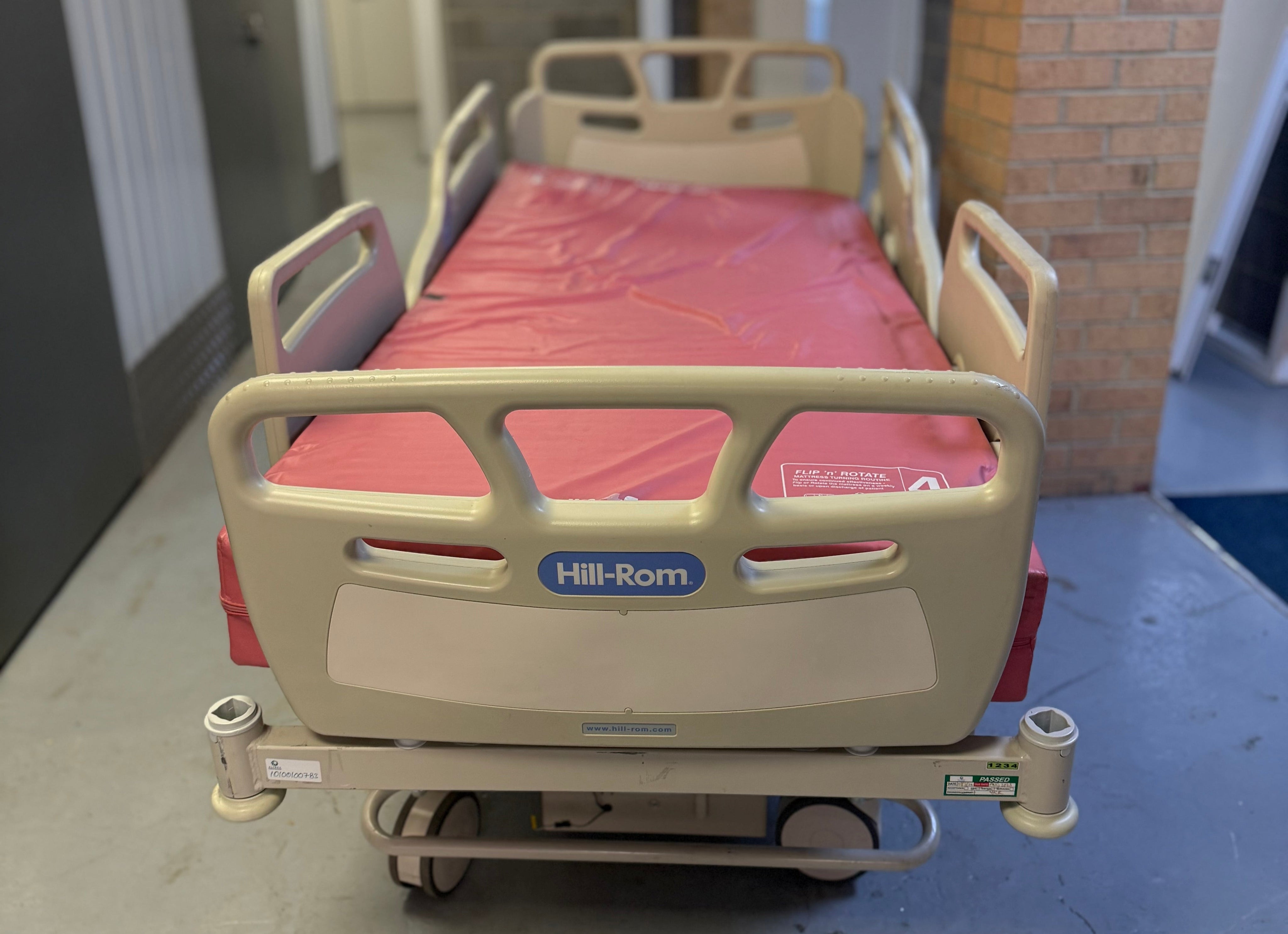 Fully adjustable Hill-Rom bed with included mattress