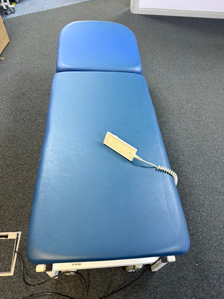 Fully reclined patient couch with backrest and footrest extended