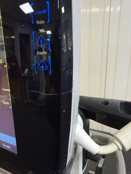 GE Venue scanner powered on, showing minor screen crack