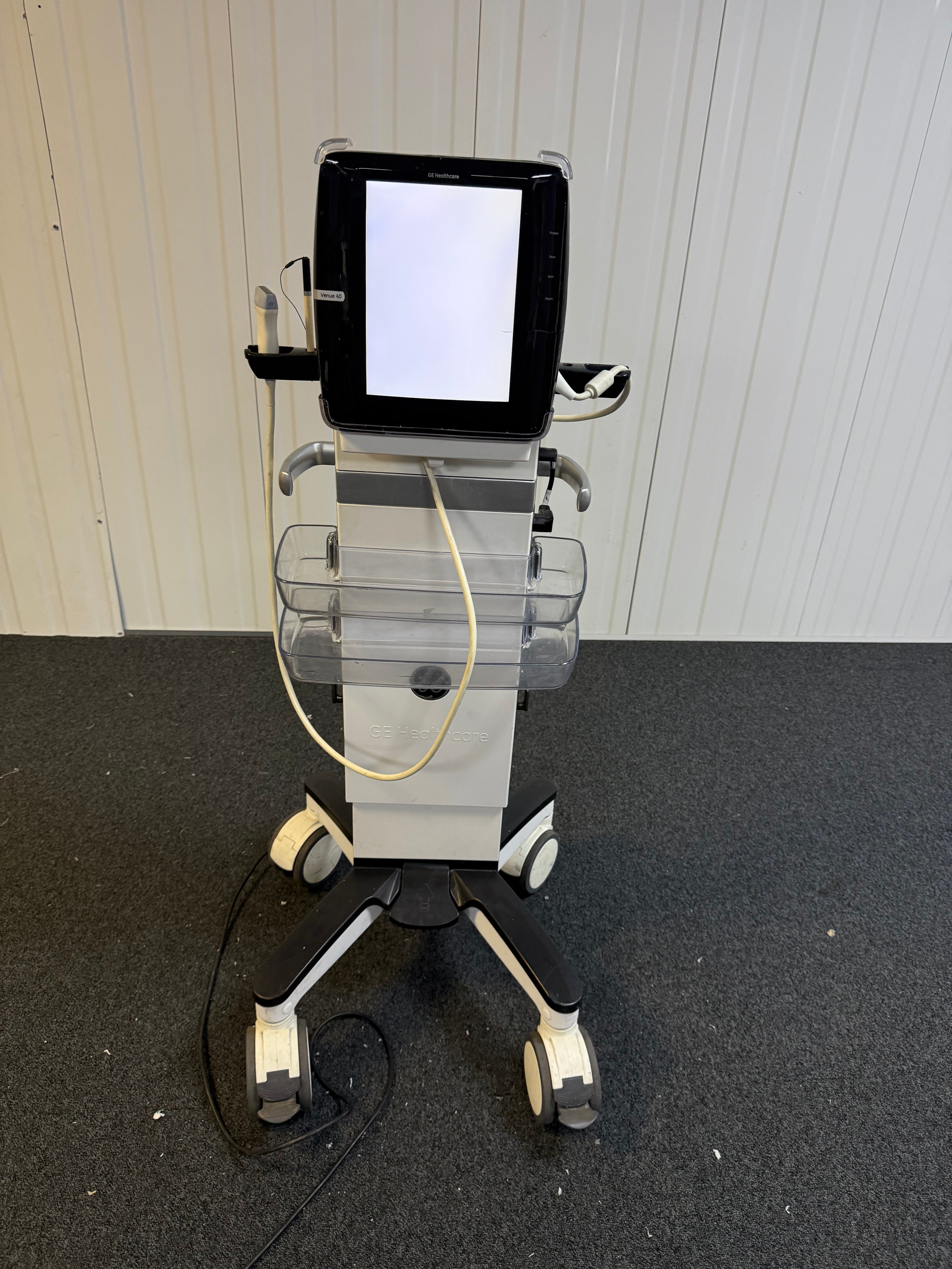 GE Venue ultrasound on docking cart with screen on