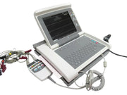 Portable medical device with screen and control panel on a white surface