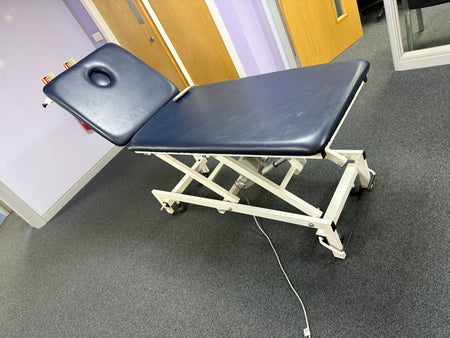 G Shaw electric couch with retractable castors for mobility