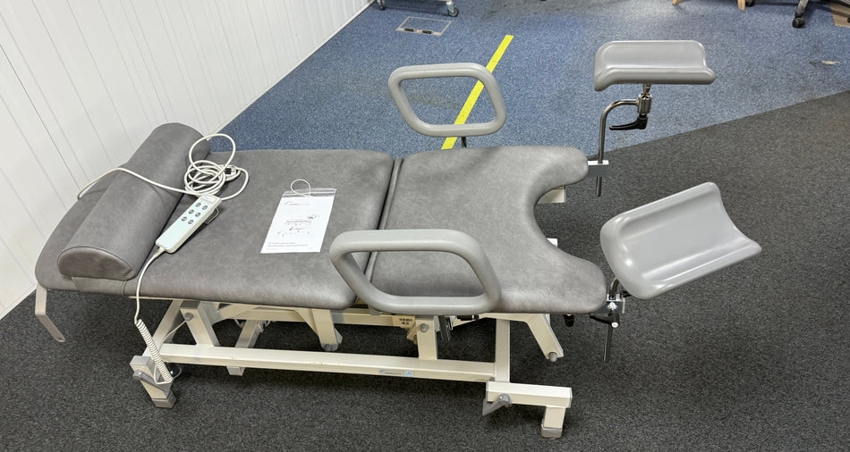 Height-adjustable examination couch with backrest raised